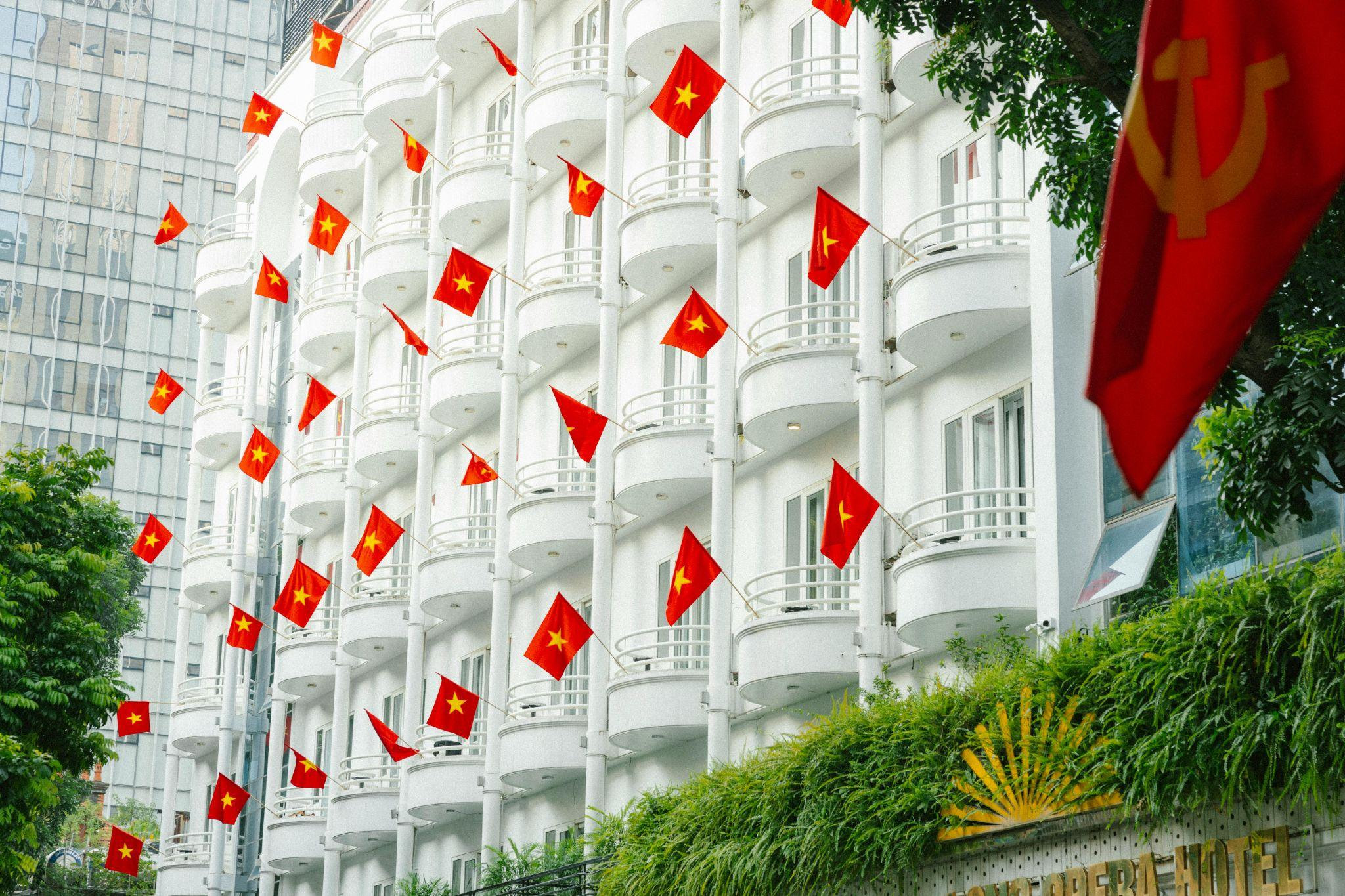 The national flag appears proudly on public buildings and homes during important holidays